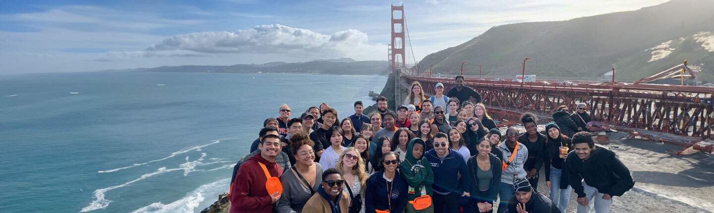 large group in front of the Golden Gate Bridge in San Francisco