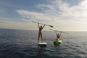 two Pepperdine students paddleboarding