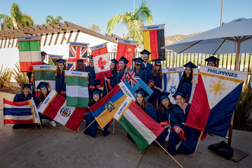 students holding international flags