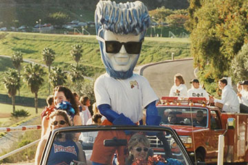 willie and alumni in a car parade